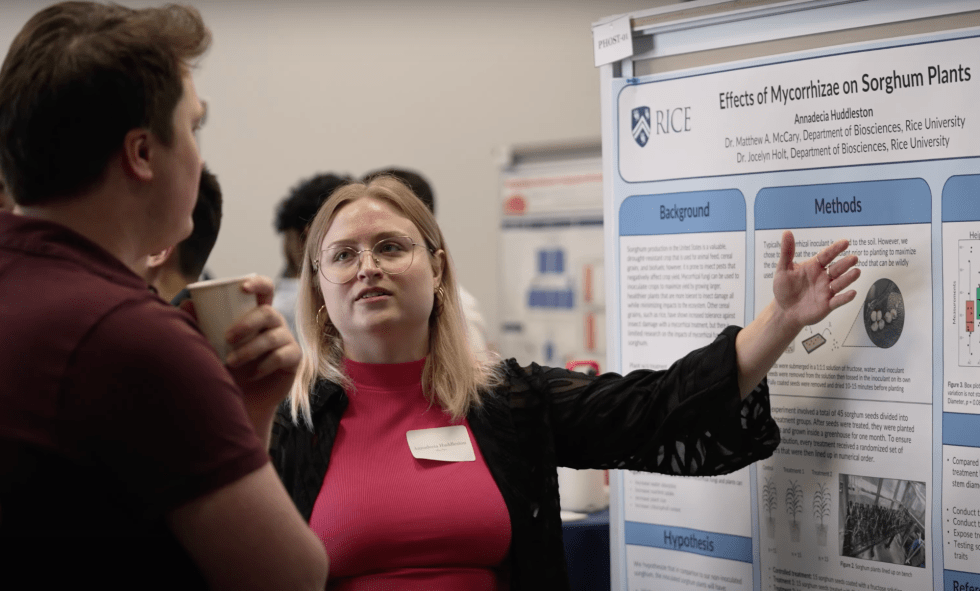 Annie Huddleston explains her research at the 2023 Summer undergraduate research symposium